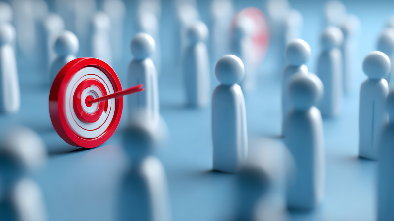 Clicks Gorilla Google Ads Precision Audience Targeting A red bullseye target with an arrow among blurred white figures, representing the precision audience targeting and high-intent customer reach provided by Clicks Gorilla for Google Ads.